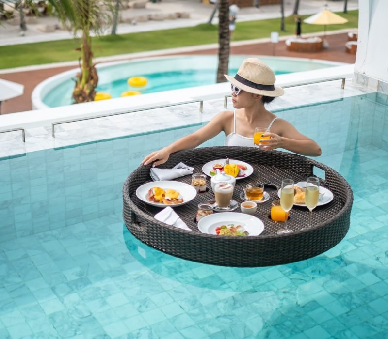woman-having-floating-breakfast-in-swimming-pool.jpg
